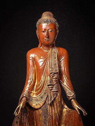 Burmese wooden Buddha statue, front torso close-up with hands and decorated sash