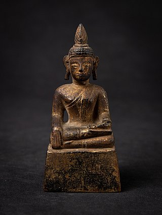Thai wooden Buddha statue seated in bhumisparsha mudra, full front view on base