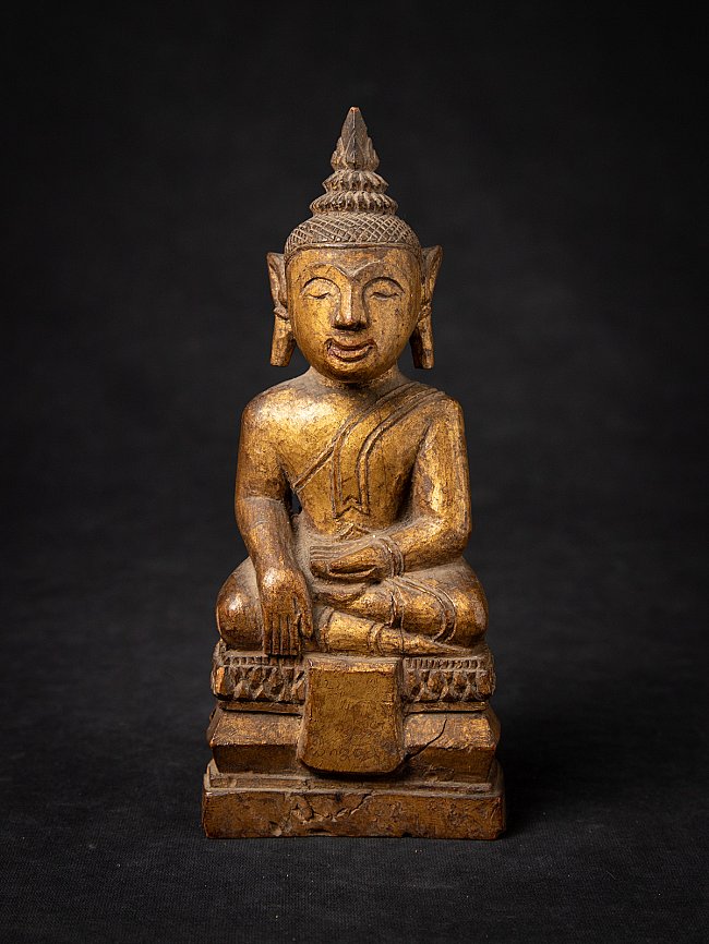 Thai wooden Buddha statue seated in bhumisparsha mudra, full front view