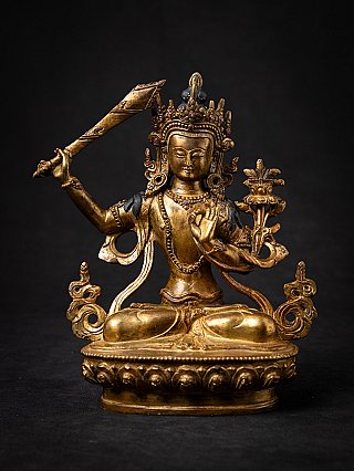Manjushri Buddha statue in bronze from Nepal, seated with sword and lotus, full front