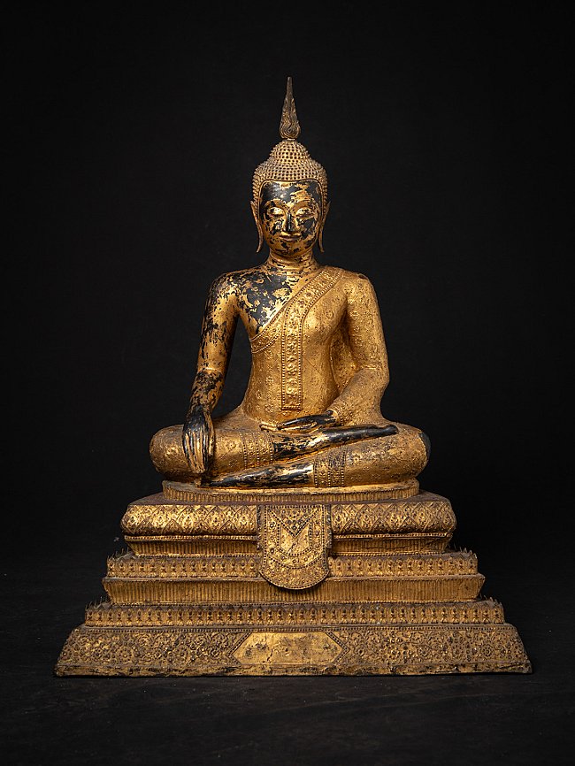 Thai bronze Buddha statue seated in Bhumisparsha mudra, full front view on tiered base