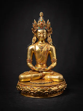 Bronze Nepali Buddha statue seated in dhyana mudra on a round lotus base, full front view
