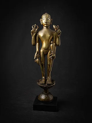 Bronze Vishnu statue from India, full frontal view on tall pedestal with four arms