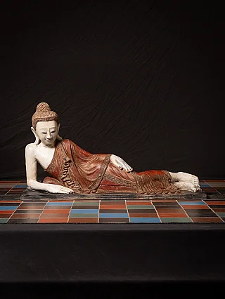 Burmese reclining Buddha statue in lacquerware with red robe, full view on base