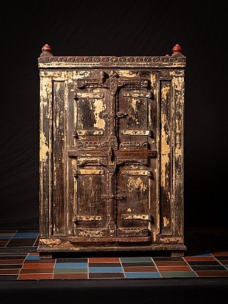 Antique wooden Indian cabinet, full front view with double doors and central metal latch
