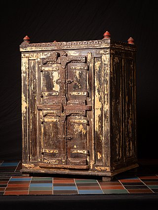 Antique 19th-century wooden Indian cabinet, three-quarter view of the front with iron hardware