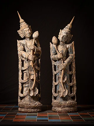 Burmese Nat statue pair in wood, full front view with tall headdresses and staffs