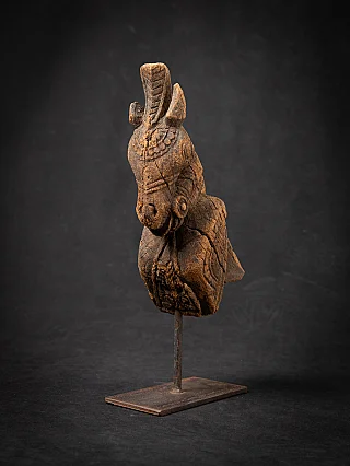 Antique wooden temple fragment of a Horse head