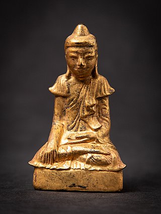 Wooden Burmese Buddha statue in Shan style, seated in bhumisparsha mudra, front view