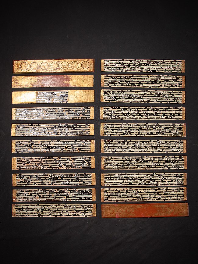 Kammavaca manuscript from Burma, laid-out ivory leaves with black script and gilt borders