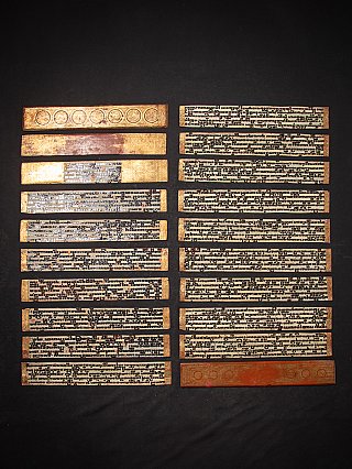Kammavaca manuscript from Burma, laid-out ivory leaves with black script and gilt borders