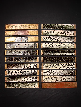 Kammavaca manuscript from Burma, laid-out ivory leaves with black script and gilt borders