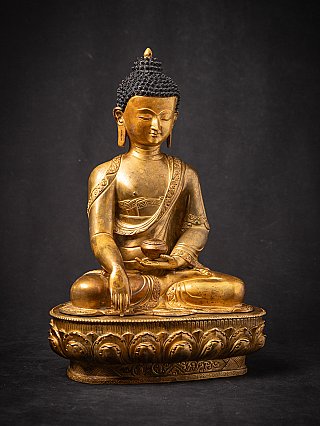 Sitzende Buddha-Statue aus Bronze aus Nepal in Bhumisparsha-Mudra, leicht gedreht