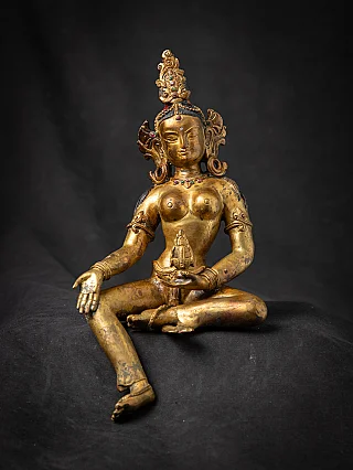 Nepalesische Bodhisattva-Statue aus Bronze, sitzend mit ausgestrecktem Bein und Varada-Mudra, Frontalansicht