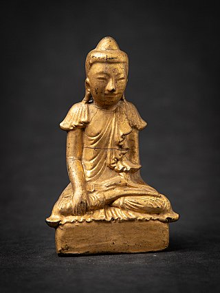 Antique Burmese wooden Buddha statue, full front view with age cracks