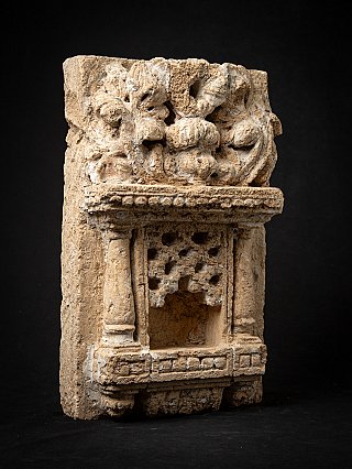Indian temple or shrine stone with niche, three-quarter left view