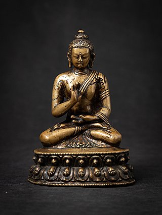 Amoghasiddhi Buddha statue in bronze from Tibet, seated with Abhaya mudra, full front view
