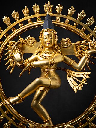 Shiva Nataraja statue close-up of torso and raised leg with the halo ornaments