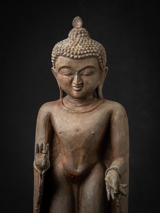 Close-up of the face and chest of the bronze Buddha from Burma (Myanmar)
