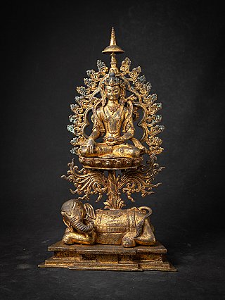 Nepali bronze Buddha statue on lotus throne above an elephant base, full front view