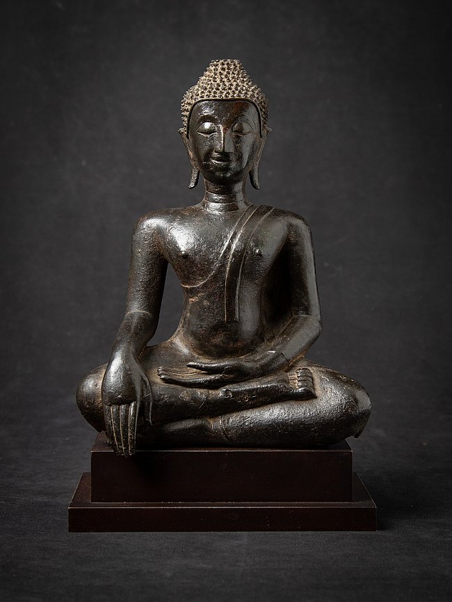 Antique Thai bronze Buddha statue, full front view seated in bhumisparsha mudra on wooden base