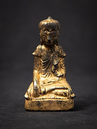 Antique wooden Burmese Buddha statue in bhumisparsha mudra, full front view with worn gilding