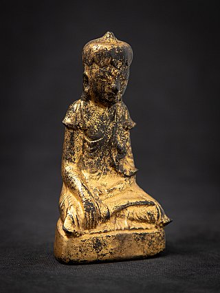 Antique wooden Burmese Buddha statue, three-quarter view with earth-touching bhumisparsha gesture