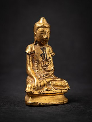 Antique wooden Shan Buddha statue, three-quarter left view with bhumisparsha mudra hand lowered