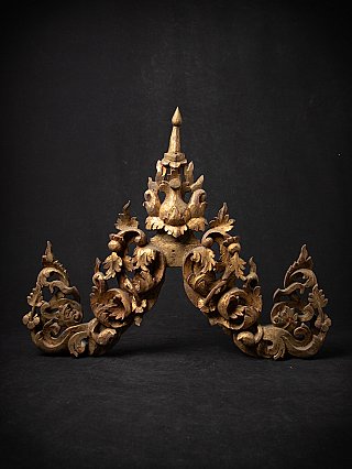 Antique Burmese wooden temple panel with pierced foliate carving and finial, frontal view
