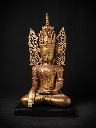 Crowned Buddha statue from Myanmar in bhumisparsha mudra, full front on black plinth