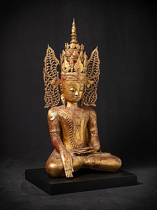 Crowned Buddha statue from Myanmar, three-quarter view with bhumisparsha mudra