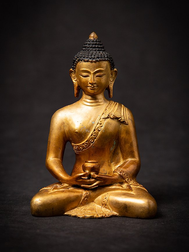 Old bronze Nepali Buddha statue