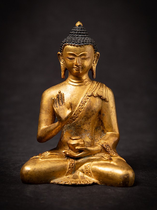 Old bronze Nepali Buddha statue