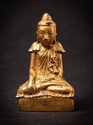 Burmese wooden Buddha statue seated in bhumisparsha mudra, full front view