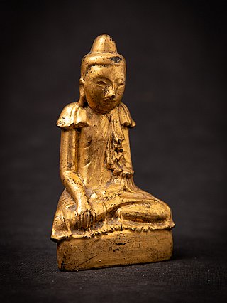 Shan-style Burmese wooden Buddha statue, three-quarter view with bhumisparsha hand