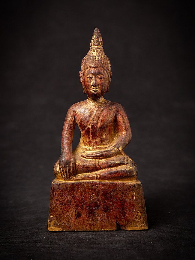 Thai wooden Buddha statue seated in bhumisparsha mudra, full front view