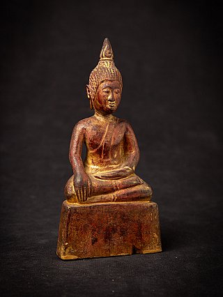 Antique wooden Thai Buddha statue