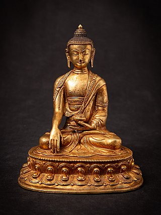 Buddha statue in bronze from Nepal, seated in bhumisparsha mudra, full front view