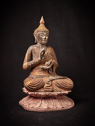 Old wooden Thai Buddha statue