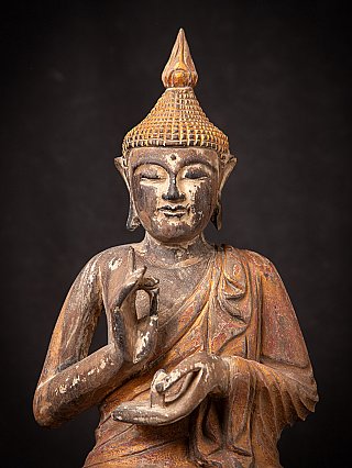 Old wooden Thai Buddha statue