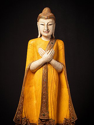 Wooden standing Thai Buddha statue