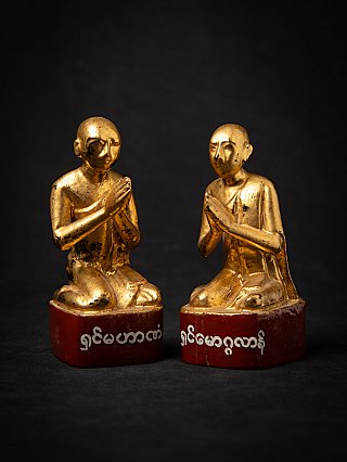 Set of Burmese wooden monk statues with gilded surface, kneeling in namaskara mudra