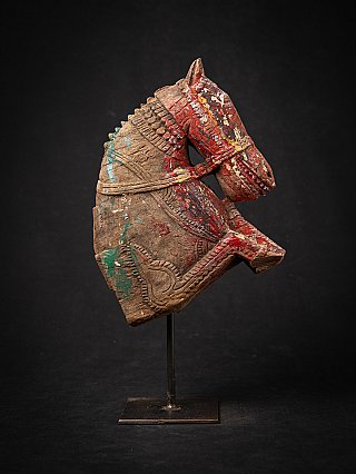 Antique wooden Indian temple fragment horse head, left side view with red paint traces
