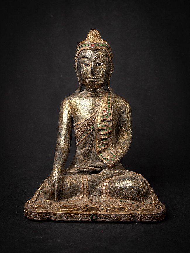 Thai wooden Buddha statue seated in bhumisparsha mudra, full front view