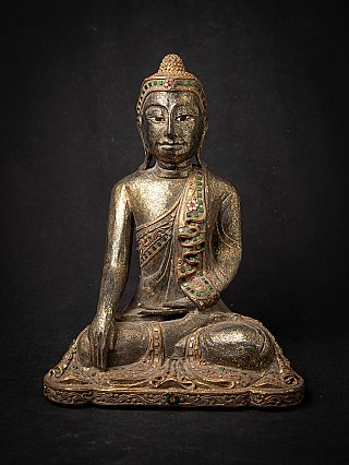 Thai wooden Buddha statue seated in bhumisparsha mudra, full front view