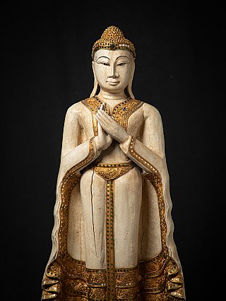 Wooden standing Thai Buddha statue