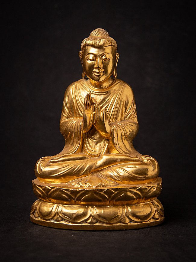 Old gilded wooden Burmese Buddha statue