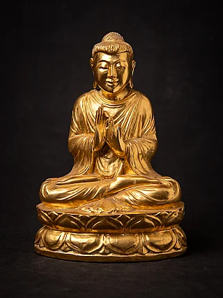 Old gilded wooden Burmese Buddha statue