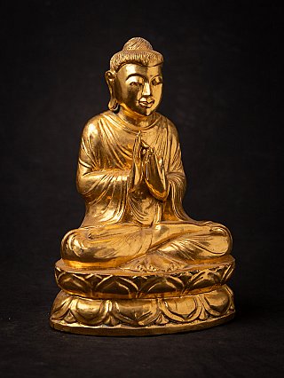 Old gilded wooden Burmese Buddha statue