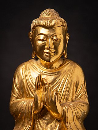 Old gilded wooden Burmese Buddha statue